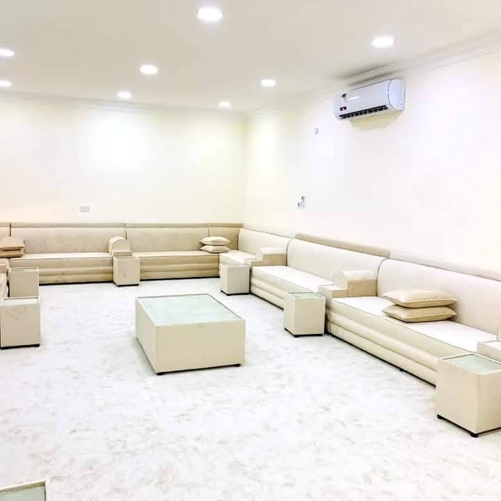 Cream majlis seating with recessed ceiling lighting