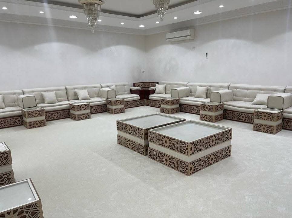 Cream majlis with carved geometric coffee tables